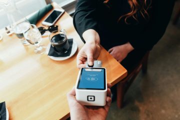 A person making a payment via a mobile banking app.